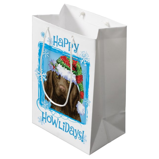 Happy Howlidays Flat-beschichteter Retriever Mittlere Geschenktüte (Vorderseite Schrägansicht)