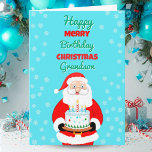 Happy Merry Birthday Weihnachten Santa Grandson Karte<br><div class="desc">Feiern Sie den Weihnachtsgeburtstag Ihres Enkels mit einer Karte,  die Glitzern mit Freude! Der Weihnachtsmann trägt einen festlichen Geburtstagskuchen,  der den Zauber von Weihnachten und das Glück seines besonderen Tages zusammenbringt. Eine fröhliche Art,  Ihrem Enkel zu zeigen,  wie sehr er sich in dieser Ferienzeit geliebt hat.</div>