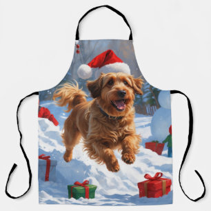 Havanese läuft im Schnee mit Weihnachtsmütze Schürze