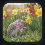 Hedgehog Sniffing a Yellow Daffodil Pappteller<br><div class="desc">A hedgehog wearing a pink scarf sniffs a spring daffodil,  capturing the scene's natural beauty with a touch of charm</div>