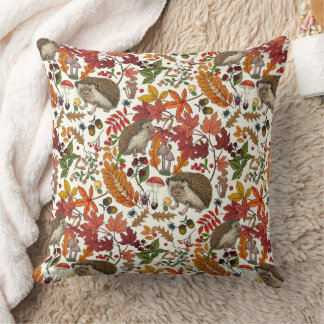 Hedgehogs and autumn forest flora on ivory kissen