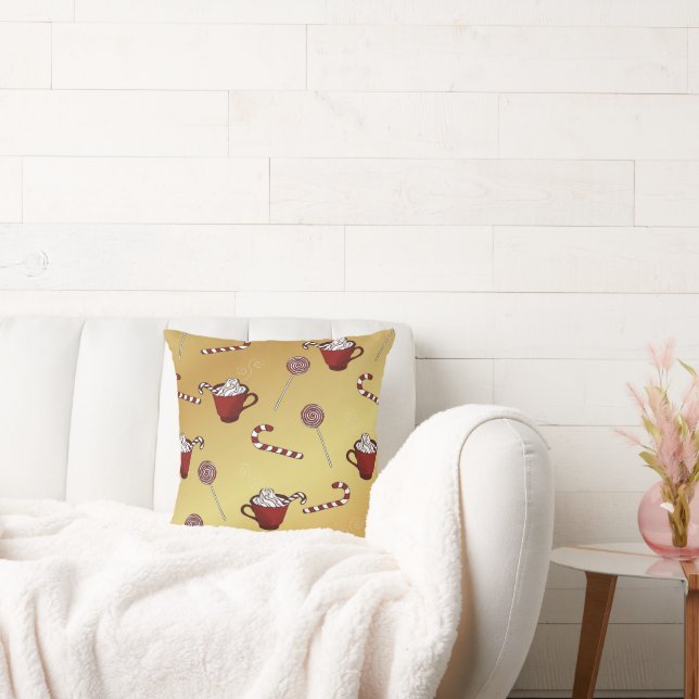 Heiße Schokolade und Bonbons auf goldenen Imitaten Kissen (Liege)