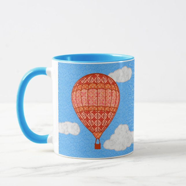 Heißluftballon, Korallenorange gegen einen blauen  Tasse (Links)