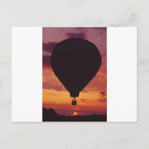 Heißluftballon mit Silhouette gegen Sonnenuntergan Postkarte