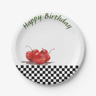 Helle rote Kirschen auf einem geprüften Tablettenk Pappteller