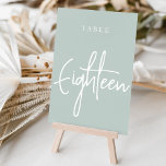 Helle Sage Green Hand Scripted Tabelle Achtzehn Tischnummer<br><div class="desc">Einfache und schicke Tischnummer-Karten in Pale Sage Green und Weiß machen eine elegante Aussage bei Ihrer Hochzeit oder Veranstaltung. Das Design bietet "table [number]" in einem spannenden Mix aus klassischen Serifen und handgeschriebenen Skripten. Design wiederholt sich auf beiden Seiten. Einzelne nummerierte Karten werden separat verkauft; bestellen Sie jede Tischnummer einzeln...</div>
