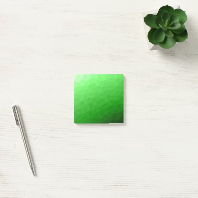 Hellgrüner geometrischer Maschenverlauf mit hellem Post-it Klebezettel (Büro)