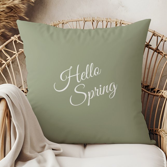 Hello Spring Sage Green Throw Pillow Kissen (Hello Spring Sage Green Throw Pillow in a  boho neutral rattan armchair.)