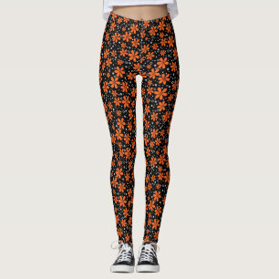 Hellorange Blume auf schwarzem Hintergrund mit w Leggings