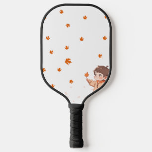 Herbstblatt, gehalten von einem niedlichen kleinen pickleball schläger