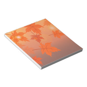 Herbstdesign mit Ahornblättern und Bokeh-Effekt Notizblock