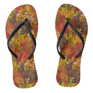Herbstkaninchen auf rot flip flops