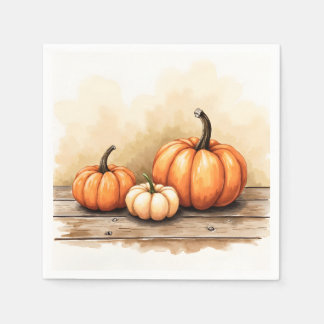 Herbstkürbisse auf Holztisch Serviette
