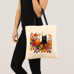 Herbstlaub und schwarze Katze Tragetasche
