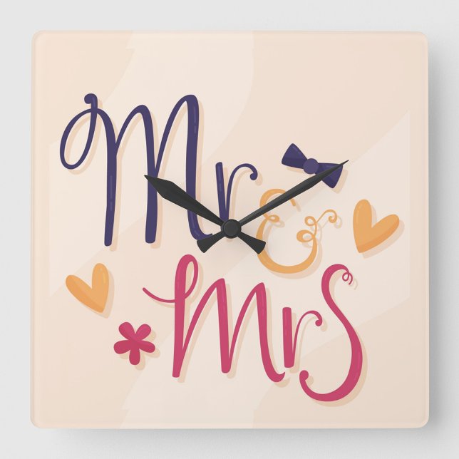 Herr und Frau Acrylic Wall Clock Quadratische Wanduhr (Square wall clock with the words "Mr. & Mrs" in a playful, cartoonish font.)