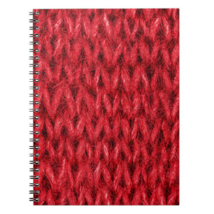 Hintergrund aus roter Strickwolle. Notizblock