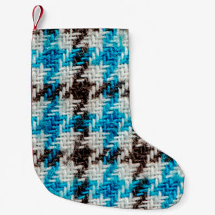 Hintergrund der Flanelltextur. Kleiner Weihnachtsstrumpf