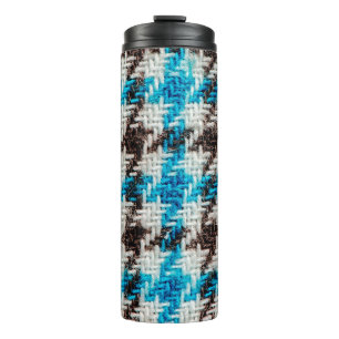 Hintergrund der Flanelltextur. Thermosbecher