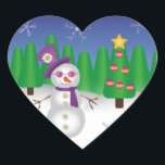 Hippie Christmas Snowman Herz-Aufkleber<br><div class="desc">Niedlicher Hippie-Schneemann mit einem lila Hut, Schal und Sonnenbrille mit Blume-Schild und einer Smiley-Blume auf dem Hut. Hinter dem Schneemann liegt eine Winterlandschaft mit Weihnachtsbäumen, Schnee und einem blauen Himmel mit Schneeflocken. Drücken Sie die orangefarbene Schaltfläche "Anpassen" oben, um den Artikel anzupassen und zu personalisieren, indem Sie einen anderen Stil...</div>