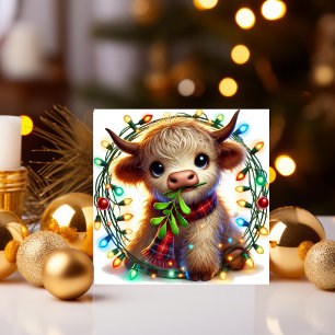Hochlandkuh mit Mistletoe und Ferienlicht Feiertagskarte