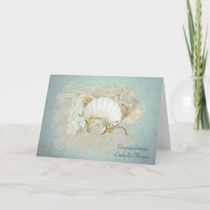 Hochzeitsringe und Muscheln Karte
