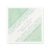 Hochzeitsweiße Spitzen auf grünem Pfefferminzpapie