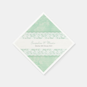 Hochzeitsweiße Spitzen auf grünem Pfefferminzpapie Serviette