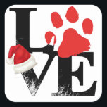 Holiday Santapaws - Paw Print in Christmas LIEBE Quadratischer Aufkleber<br><div class="desc">Ein "L" und "ein roter Pfoten" werden auf dem "V" und "E" gestapelt, um "LIEBE" zu buchstabieren, mit einer Weihnachtsmannmütze auf dem "V". Dieses schlichte Design ist eine Weihnachts-Santapaws-Grafik, die Liebe für alle vier Beinfreunde zeigt. Wenn Ihr Haustier ein Hund, Katze, Kaninchen, Schildkröte, Hamster oder ein anderer besonderer Freund ist,...</div>