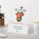 Holly Christmas Santa Baby Dusche Mimosa Bar Sockelschild<br><div class="desc">Set ein festlicher Ton mit unserem Weihnachtsdusche Mimosa Bar Sign. Mit einem fröhlichen Santa Claus-Design, umgeben von heiliger und winterlicher Vegetation, fügt dieses Schild Ihrer mimosa Bar eine Touch von Urlaubsmagie hinzu. Es eignet sich hervorragend, um die Gäste zu dieser köstlichen Getränkestation zu führen und so die Urlaubsatmosphäre Ihrer Babydusche...</div>