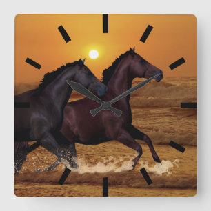 Horses running at ocean sunset quadratische wanduhr