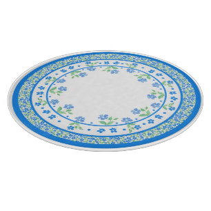 Hübsche blaugrüne Periwinkles, florale, rund um di Schneidebrett