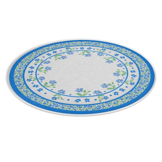 Hübsche blaugrüne Periwinkles, florale, rund um di Schneidebrett (Ecke)