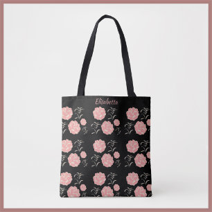 Hübsche große rosa Rosen mit Folionen auf schwarz