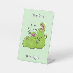 Hübsche grüne Fleischfresser-Pflanze Cartoon Sockelschild