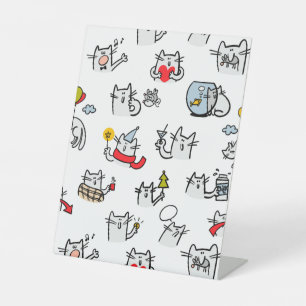Hübsche Katzen, Milch und Magie. Sockelschild