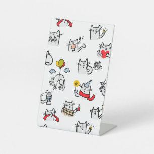 Hübsche Katzen, Milch und Magie. Sockelschild