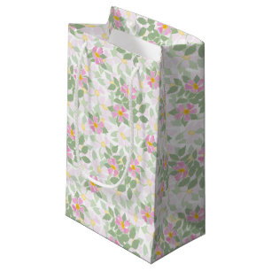 Hübsche, rosa Hundehunde-Rose auf weißem, kleinem Kleine Geschenktüte