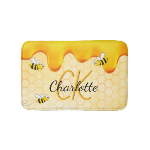 Hummelbienen, Honigwabenhonig, das ein Monogramm t Badematte