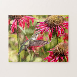 Hummingbird auf einer blühenden Pflanze Puzzle