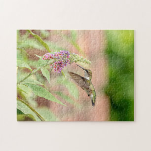 Hummingbird auf einer blühenden Pflanze Puzzle