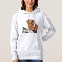 Hund sitzt vor einer Zeitschrift