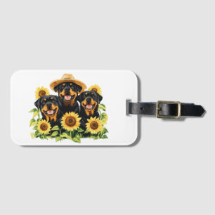 Hunde von Rottweiler, umgeben von Sonnenblumen Gepäckanhänger