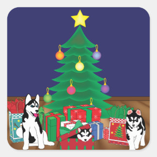 Huskies, die unter der Weihnachtsbaumkarte spielen Quadratischer Aufkleber