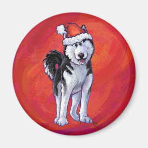 Husky in Weihnachtsmannmütze auf Rot Magnet