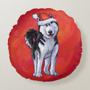 Husky in Weihnachtsmannmütze auf Rot Rundes Kissen