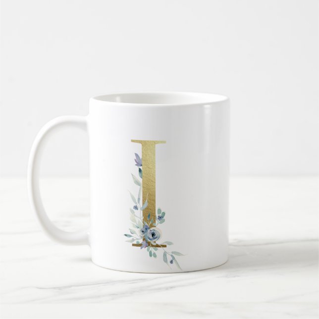 Ich golden anfänglich mit blauem Blumenblättern Kaffeetasse (Links)
