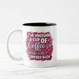 Ich halte eine Tasse Kaffee