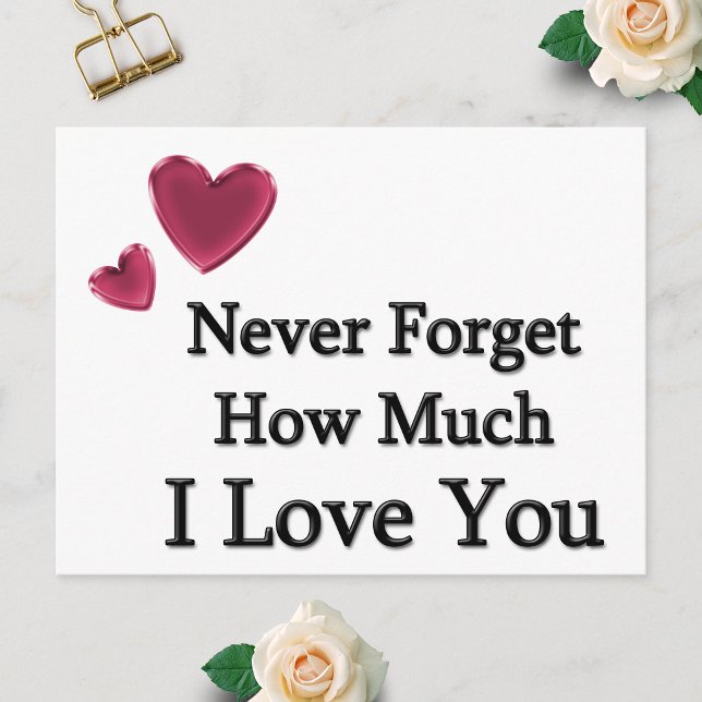 Ich liebe dich postkarte (Postcard showing Never Forget How Much I Love You with two hearts, laid flat on a white surface.)