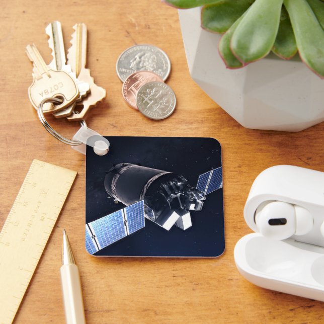 Illustration der Dragon XL-Raumsonde. Schlüsselanhänger (Schreibtisch)