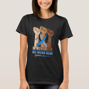Im November tragen wir eine Hand mit blauen Kur-Di T-Shirt
